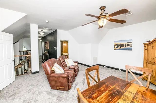 a view of a patio with furniture and a fire pit