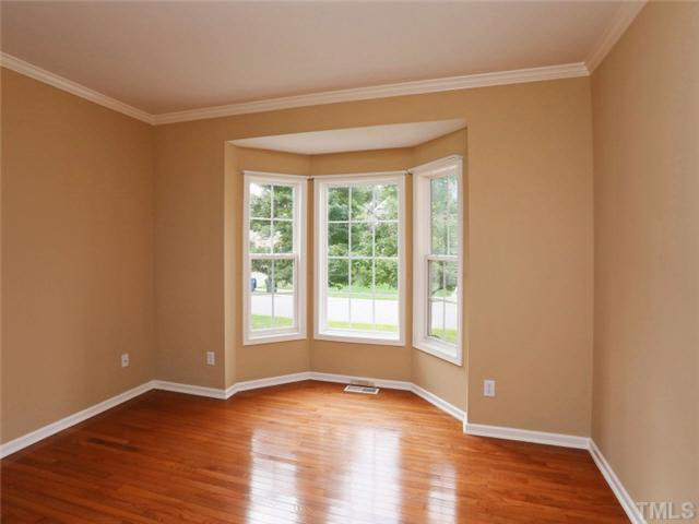 8608 Churchdown Court Raleigh, NC 27613 - Photo 6 of 25 Living room also has a bay window and beautiful hardwood floors. This room can be used as an office also. Living Room