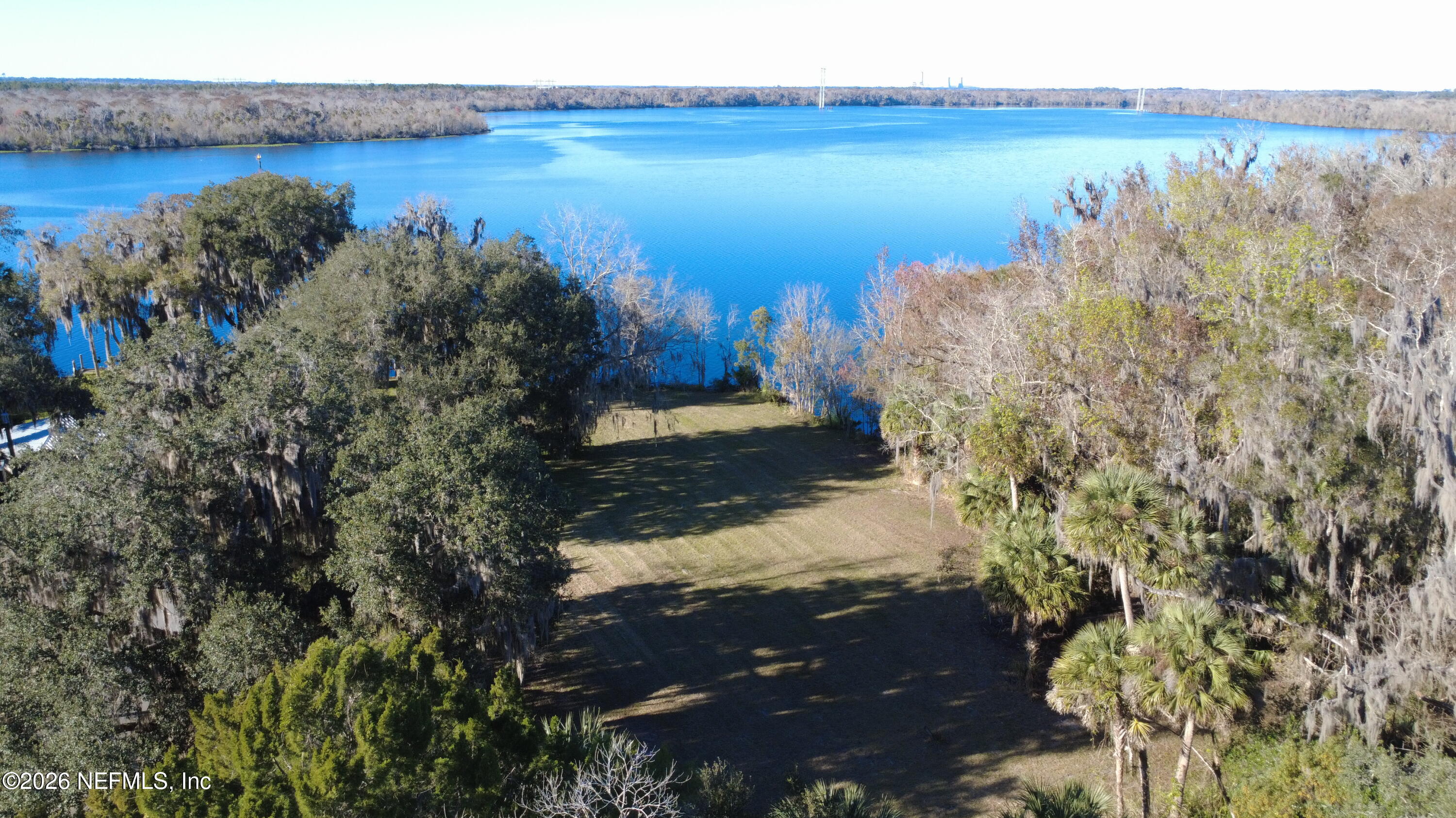 0 Weerts Road San Mateo, FL 32187 - Photo 3 of 8 a view of a lake with a yard