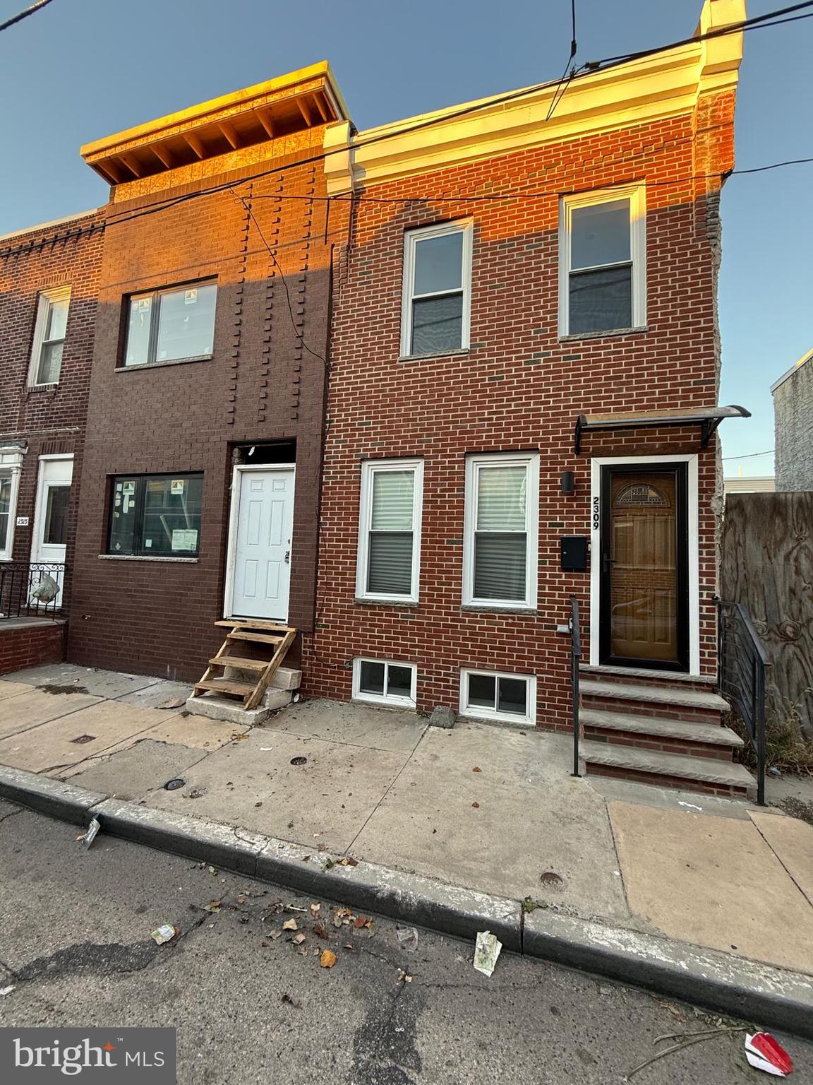 2309 Cross Street Philadelphia, PA 19146 - Photo 2 of 37 a front view of a house with a garage
