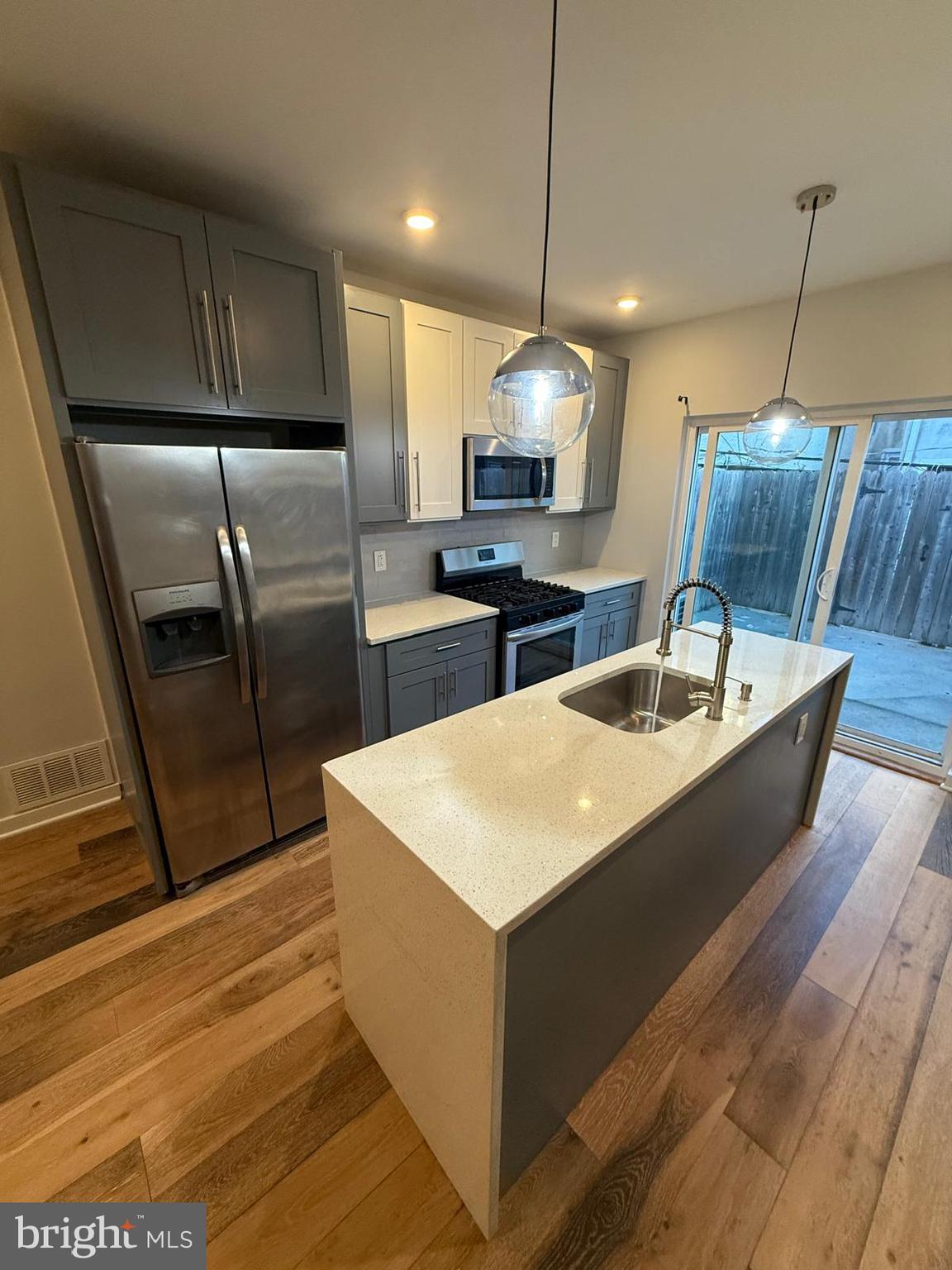 2309 Cross Street Philadelphia, PA 19146 - Photo 6 of 37 a kitchen with stainless steel appliances kitchen island granite countertop a sink a counter space and cabinets