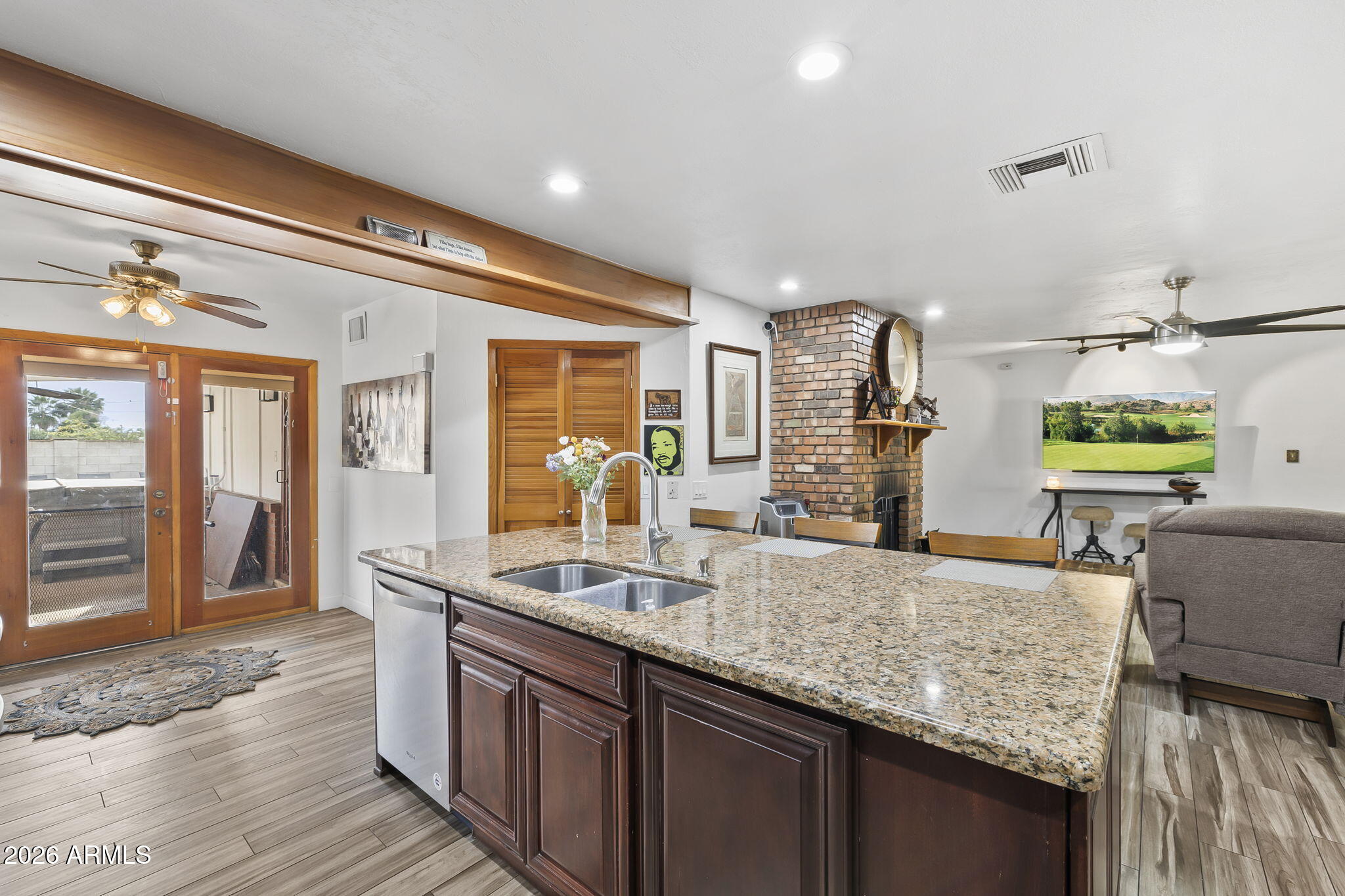 1607 West Whitton Avenue Phoenix, AZ 85015 - Photo 12 of 45 a large kitchen with granite countertop kitchen island a sink and a large mirror