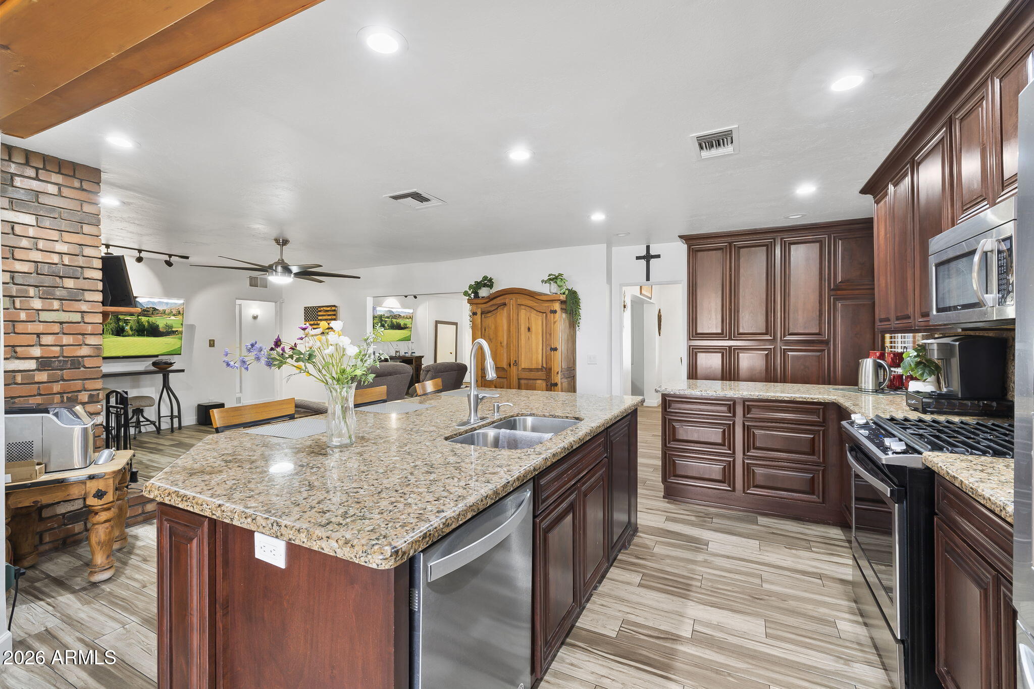 1607 West Whitton Avenue Phoenix, AZ 85015 - Photo 13 of 45 a kitchen with granite countertop kitchen island stainless steel appliances a stove sink and cabinets