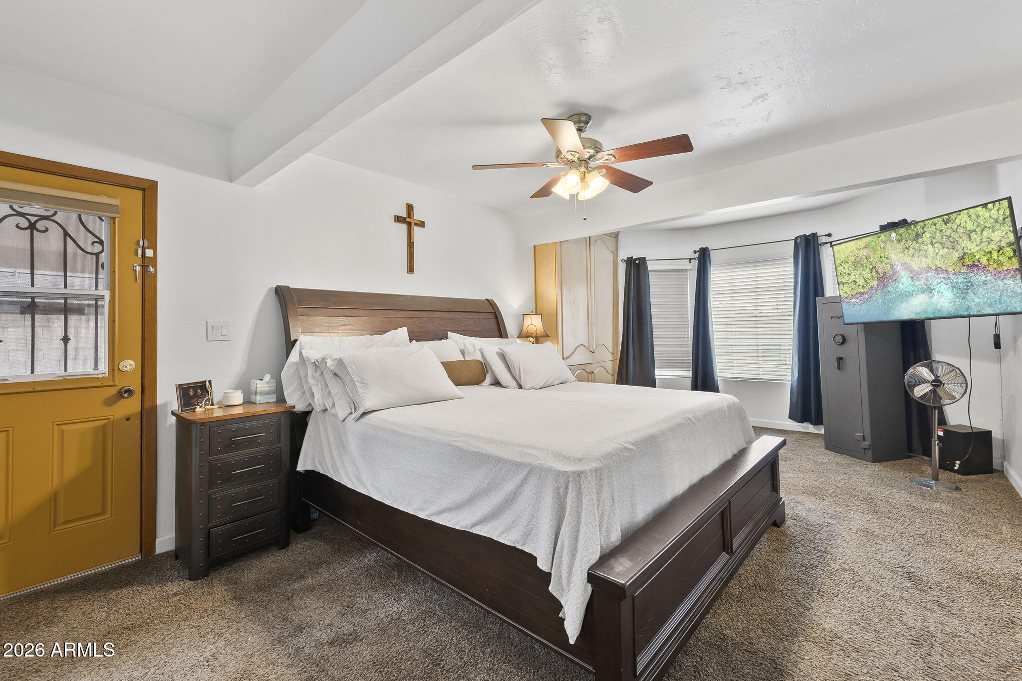 1607 West Whitton Avenue Phoenix, AZ 85015 - Photo 23 of 45 a bedroom with a bed and a chandelier