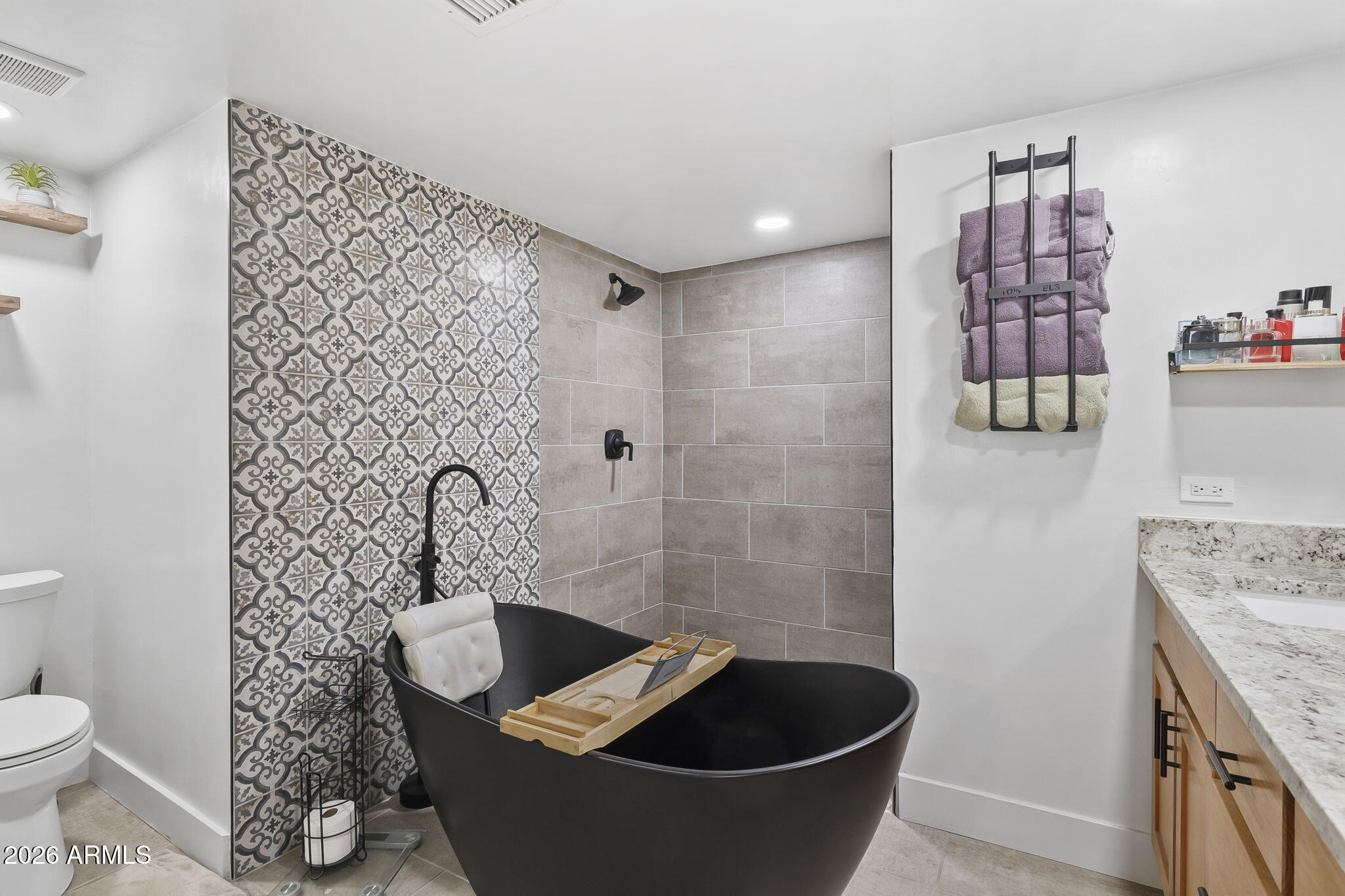 1607 West Whitton Avenue Phoenix, AZ 85015 - Photo 25 of 45 a bath room with a toilet and shower