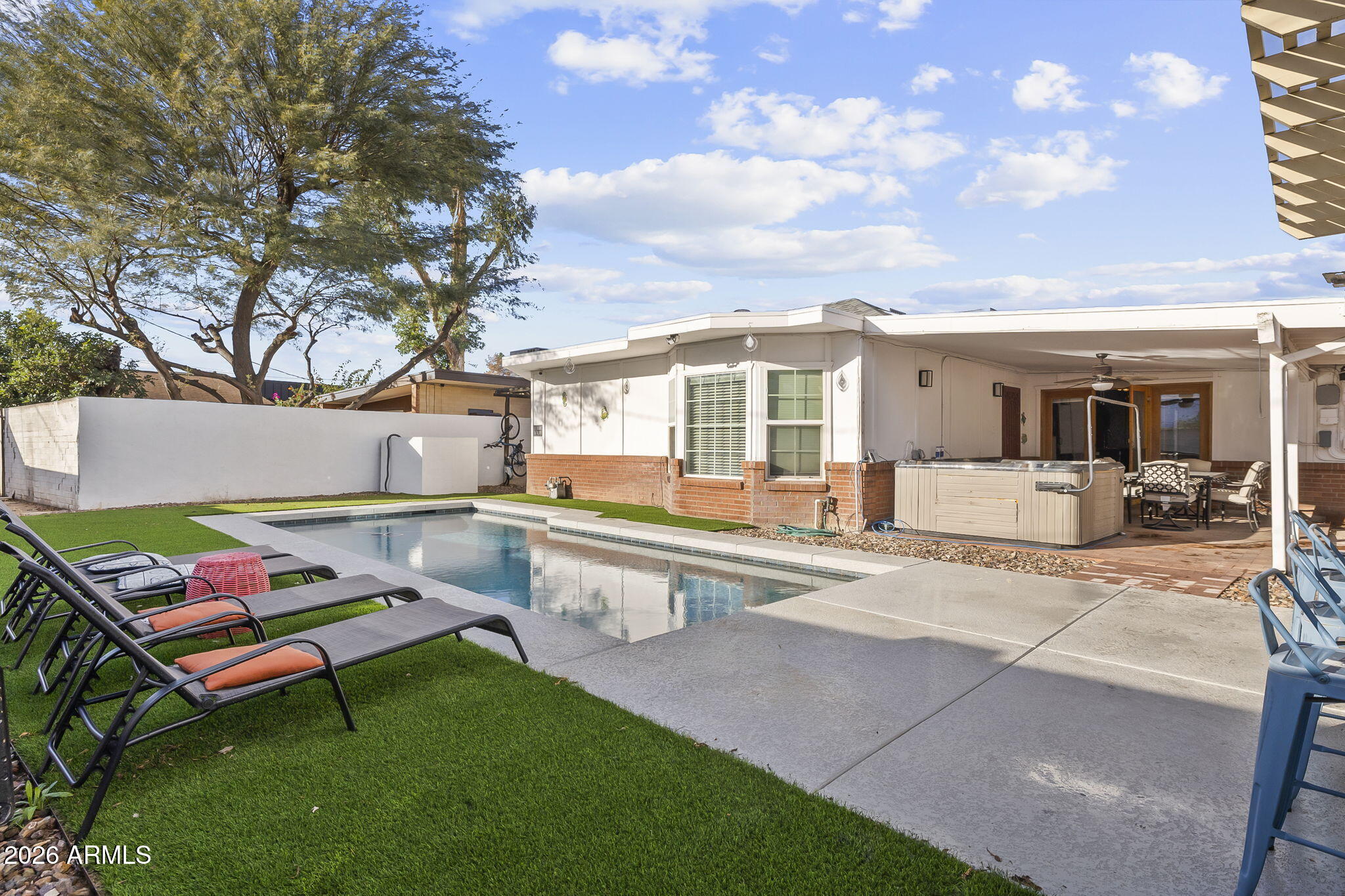 1607 West Whitton Avenue Phoenix, AZ 85015 - Photo 31 of 45 a swimming pool with outdoor seating and yard