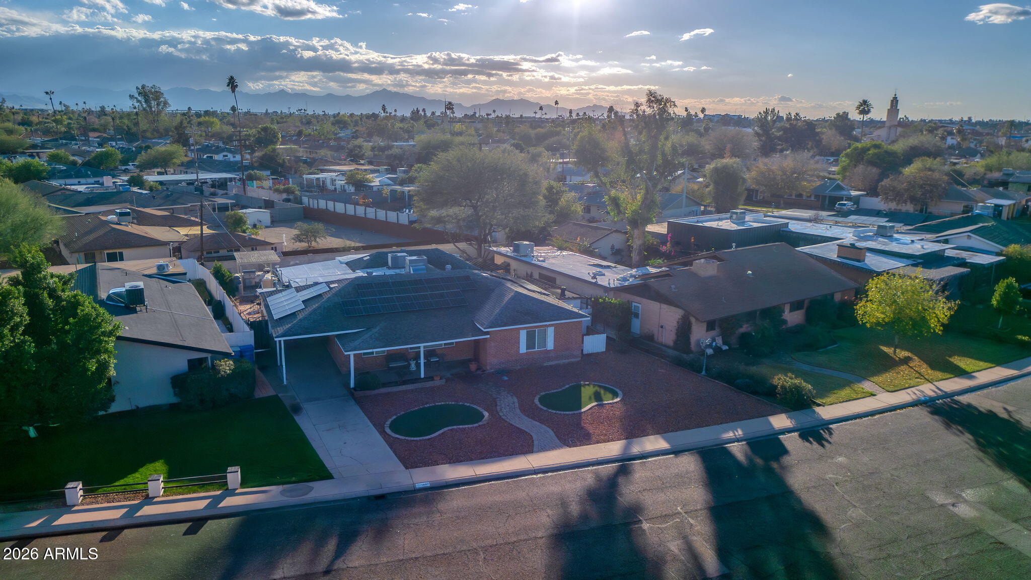 1607 West Whitton Avenue Phoenix, AZ 85015 - Photo 37 of 45 an aerial view of residential houses with outdoor space