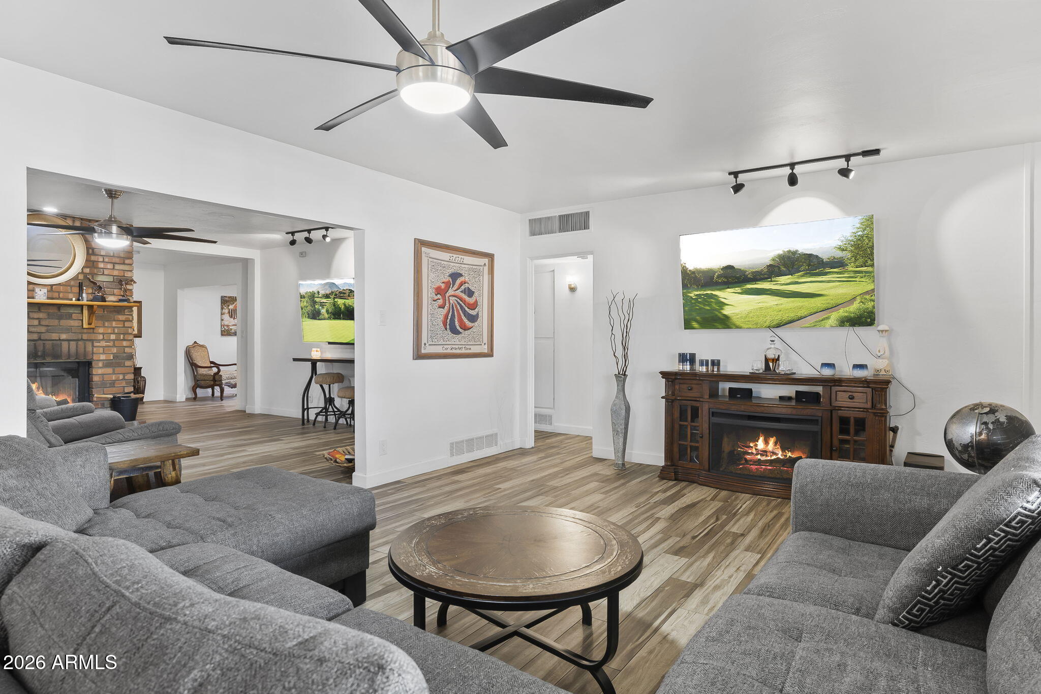 1607 West Whitton Avenue Phoenix, AZ 85015 - Photo 6 of 45 a living room with furniture and a flat screen tv