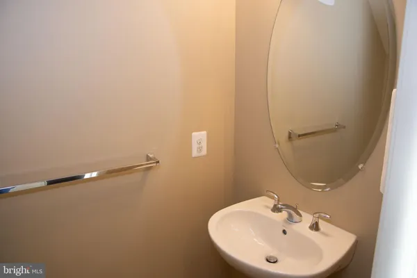 a bathroom with a sink and mirror