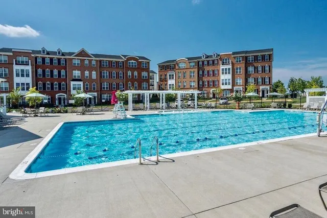a view of a park and trees in the background