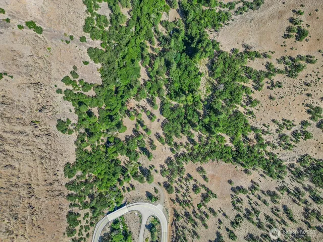 an aerial view of mountain with beach