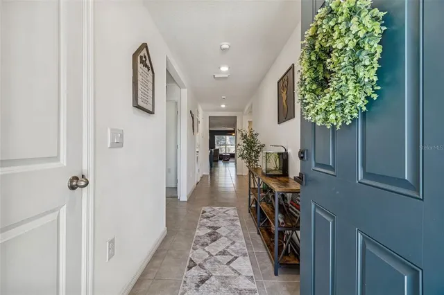 a kitchen with a sink a stove and cabinets