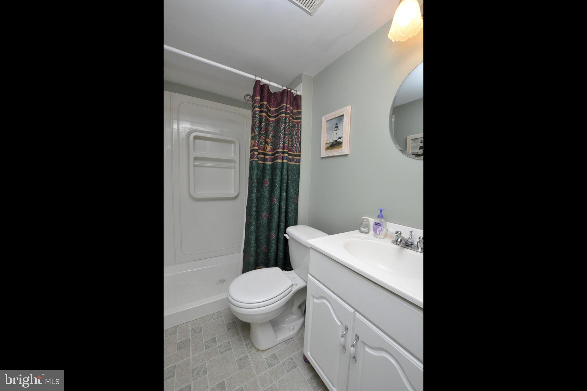 4 Henry Street Riverside, NJ 08075 - Photo 22 of 25 a bathroom with a sink toilet and shower