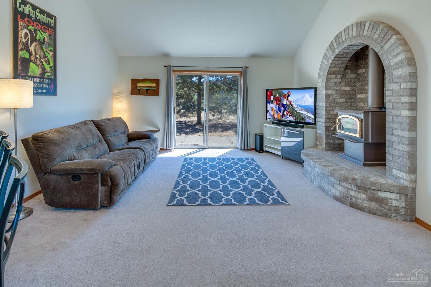 13990 South Sego Lily Road Powell Butte, OR 97753 - Photo 12 of 24 Movie night? Game day? Plenty of room!