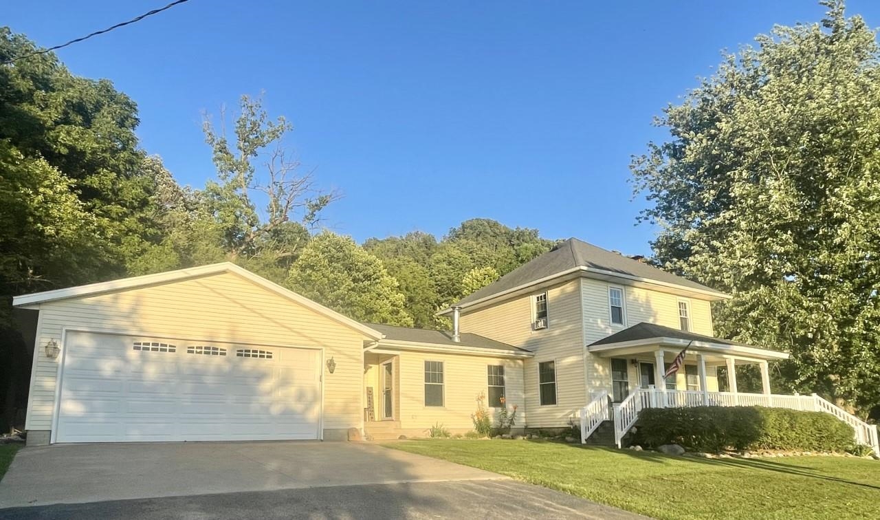 3669 Scenic Bluff Road Thomson, IL 61285 - Photo 1 of 38 a view of a white house with a yard