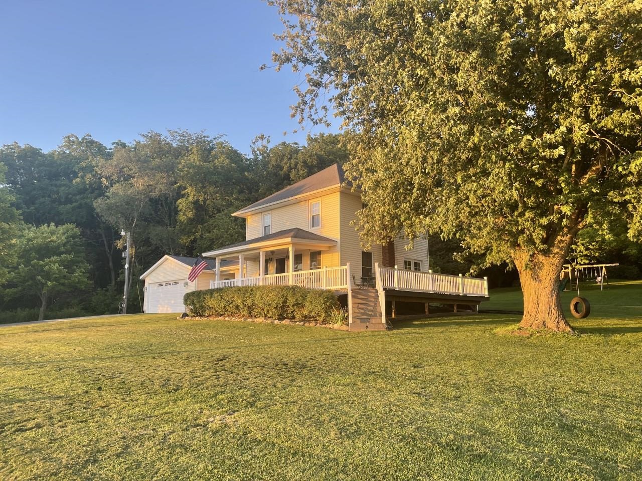 3669 Scenic Bluff Road Thomson, IL 61285 - Photo 2 of 38 a front view of a house with a yard