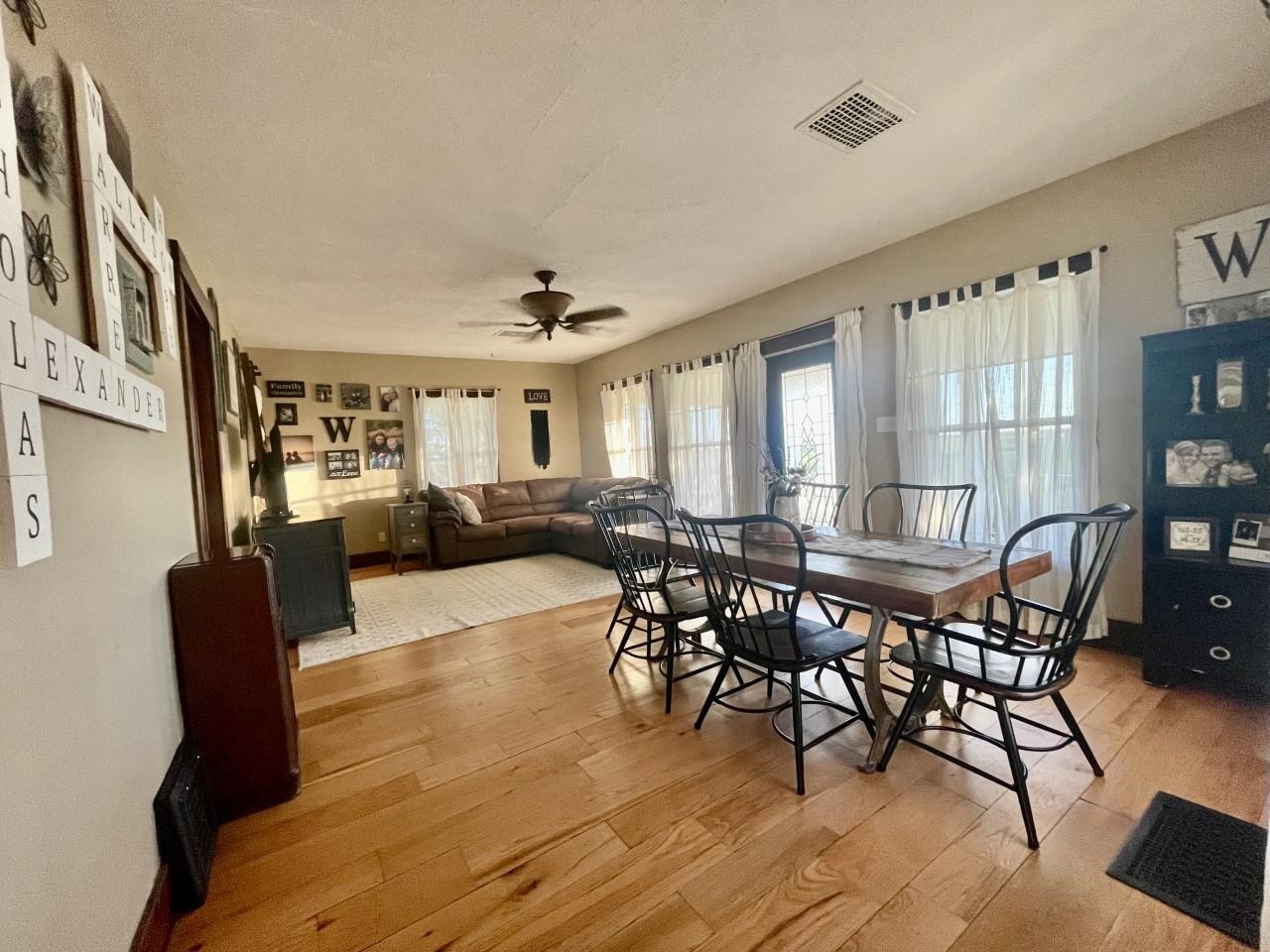 3669 Scenic Bluff Road Thomson, IL 61285 - Photo 7 of 38 a view of a dining room with furniture and wooden floor