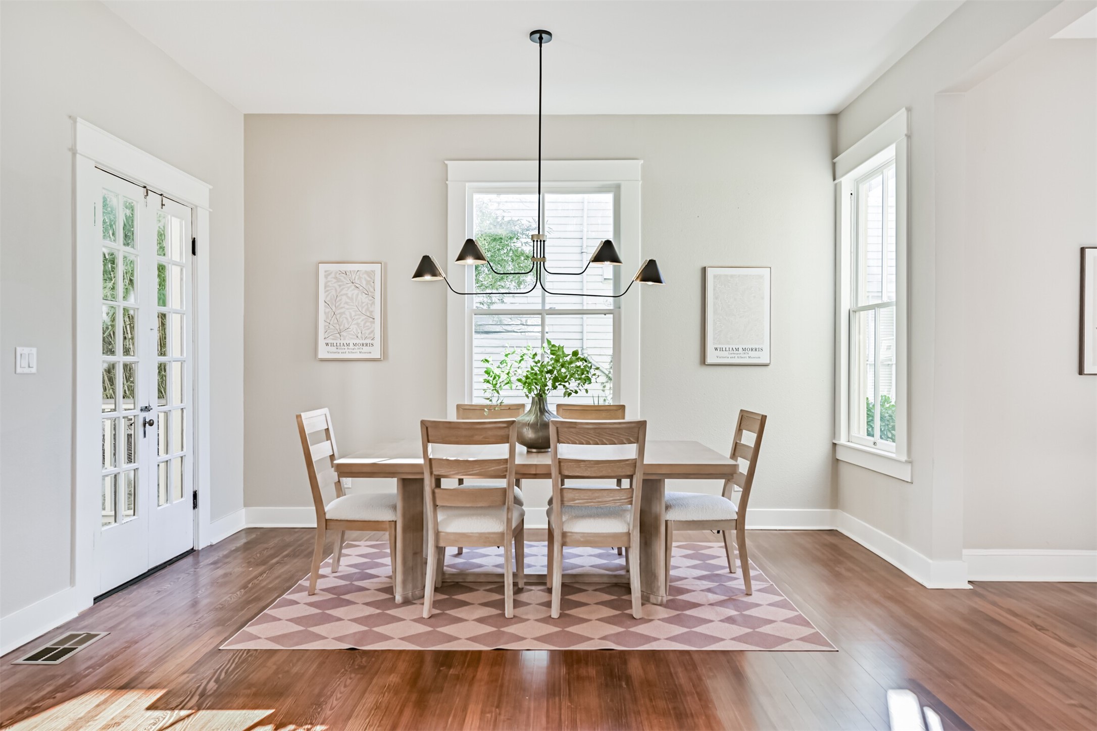 1310 Rosenberg Street Galveston, TX 77550 - Photo 12 of 50 a dining room with furniture a rug and wooden floor