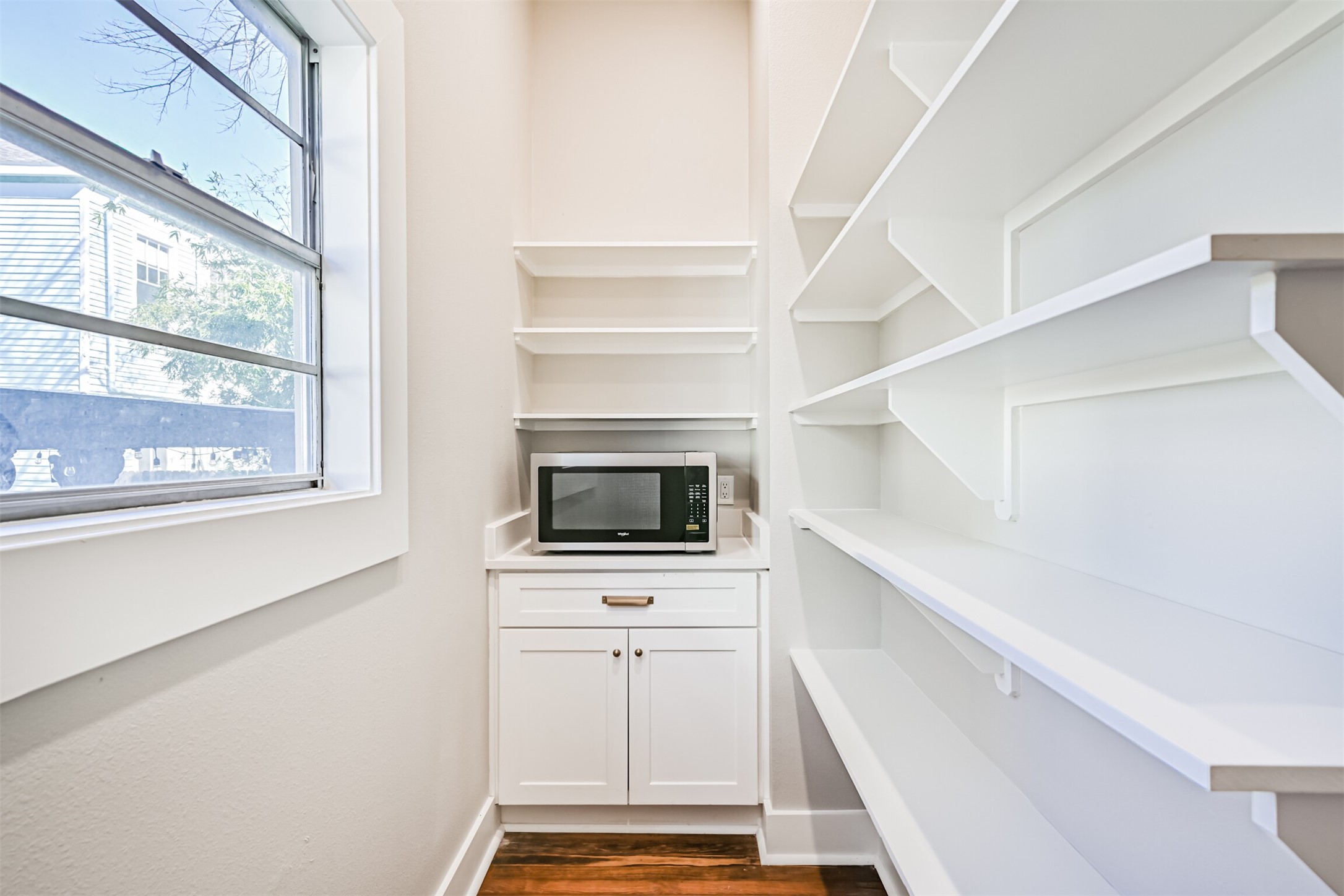 1310 Rosenberg Street Galveston, TX 77550 - Photo 15 of 50 a kitchen with white cabinets and appliances