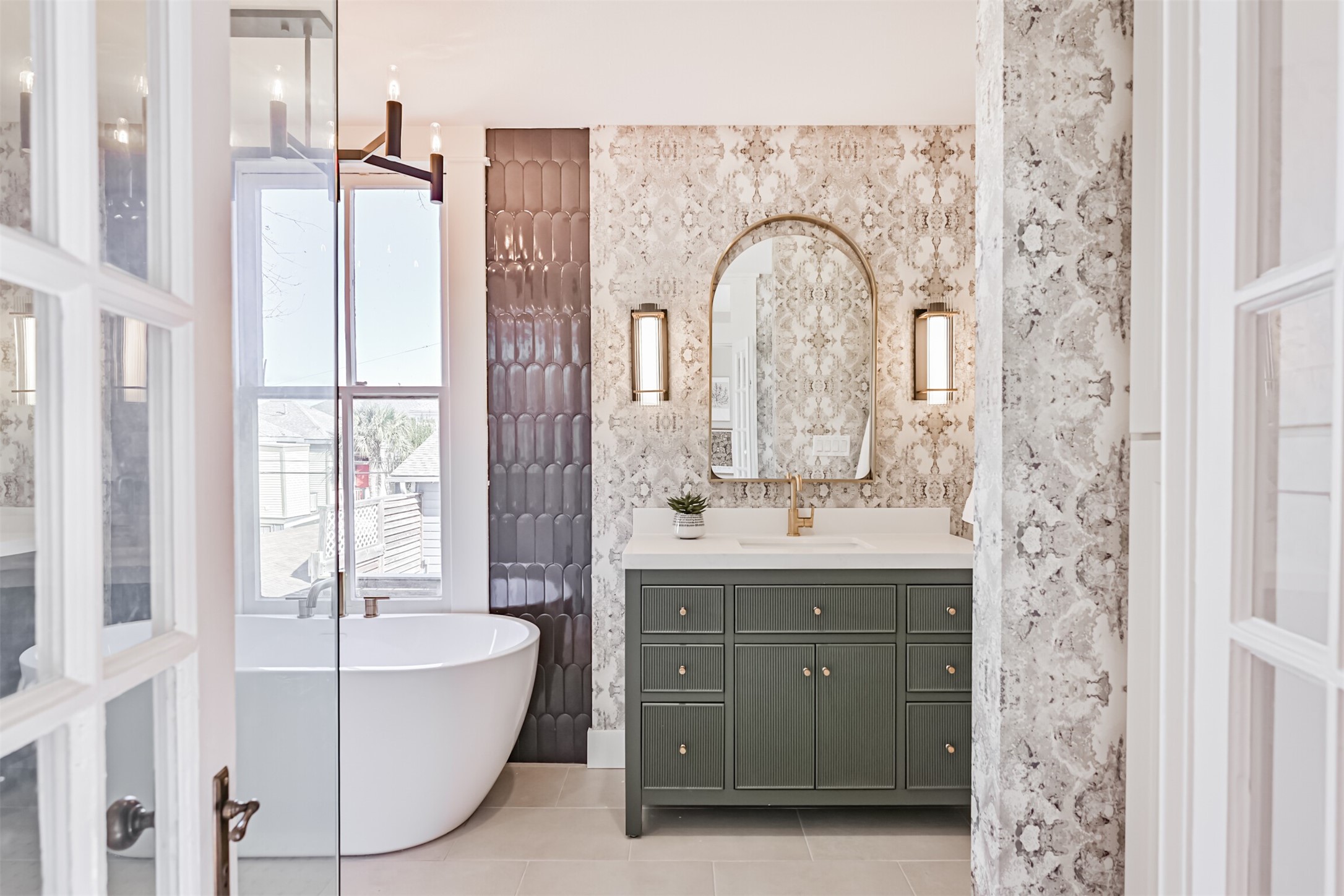 1310 Rosenberg Street Galveston, TX 77550 - Photo 19 of 50 a spacious bathroom with a tub sink and mirror