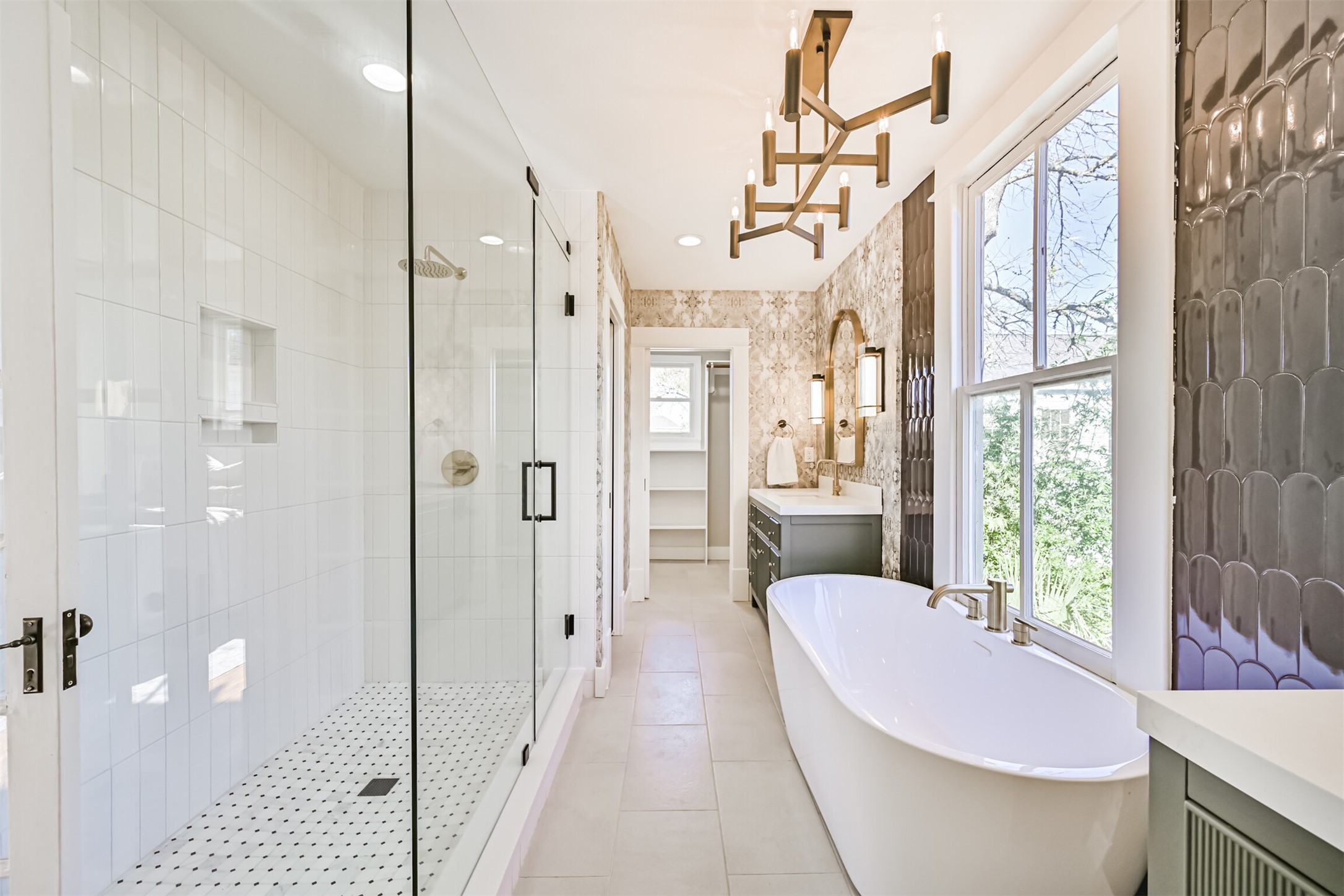 1310 Rosenberg Street Galveston, TX 77550 - Photo 21 of 50 a spacious bathroom with a bathtub shower sink and mirror