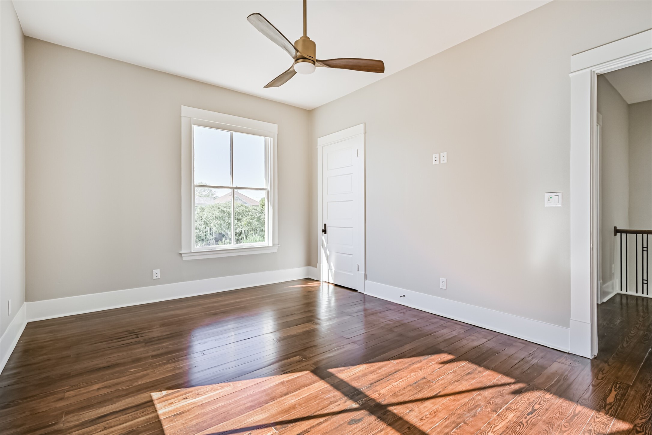 1310 Rosenberg Street Galveston, TX 77550 - Photo 31 of 50 a view of an empty room with wooden floor and a window