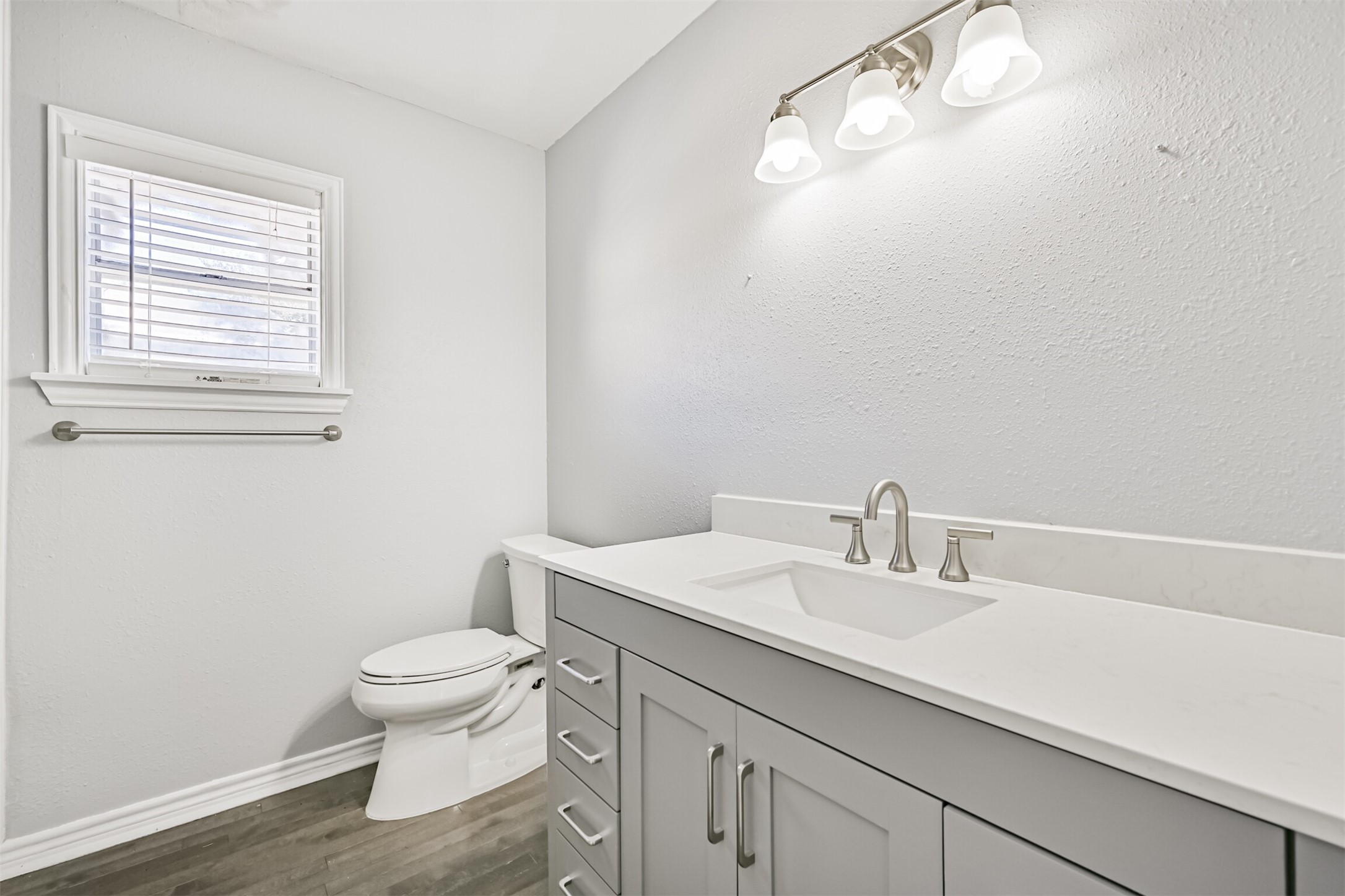 1310 Rosenberg Street Galveston, TX 77550 - Photo 38 of 50 a bathroom with a sink vanity mirror and toilet