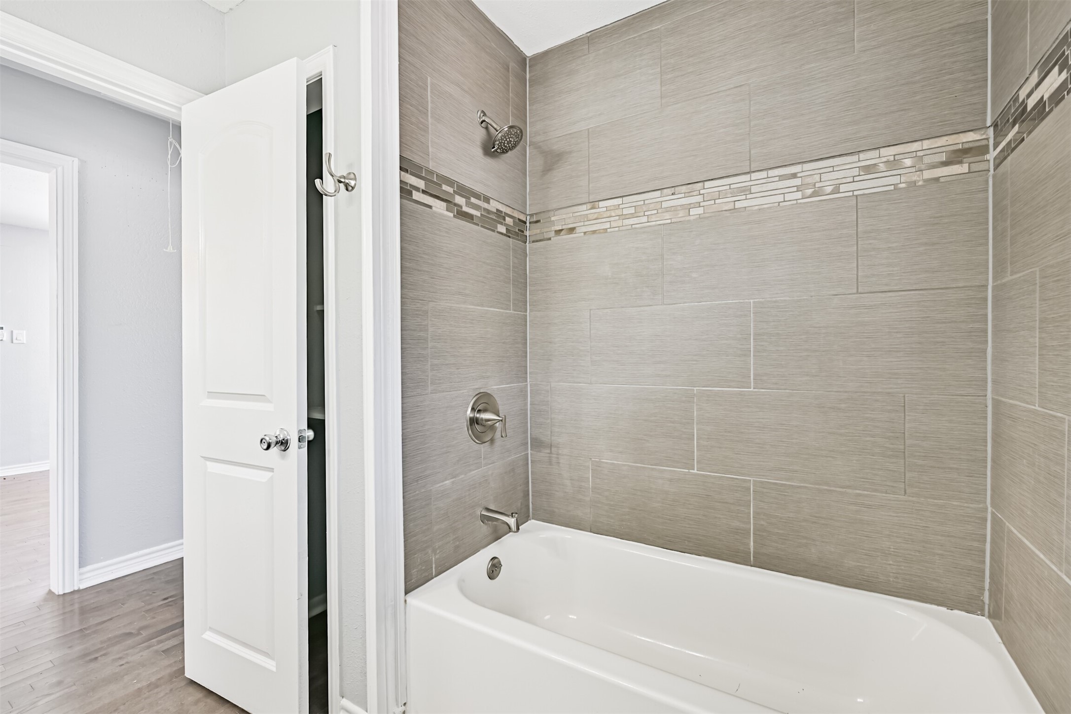 1310 Rosenberg Street Galveston, TX 77550 - Photo 39 of 50 a bathroom with a bathtub and a shower