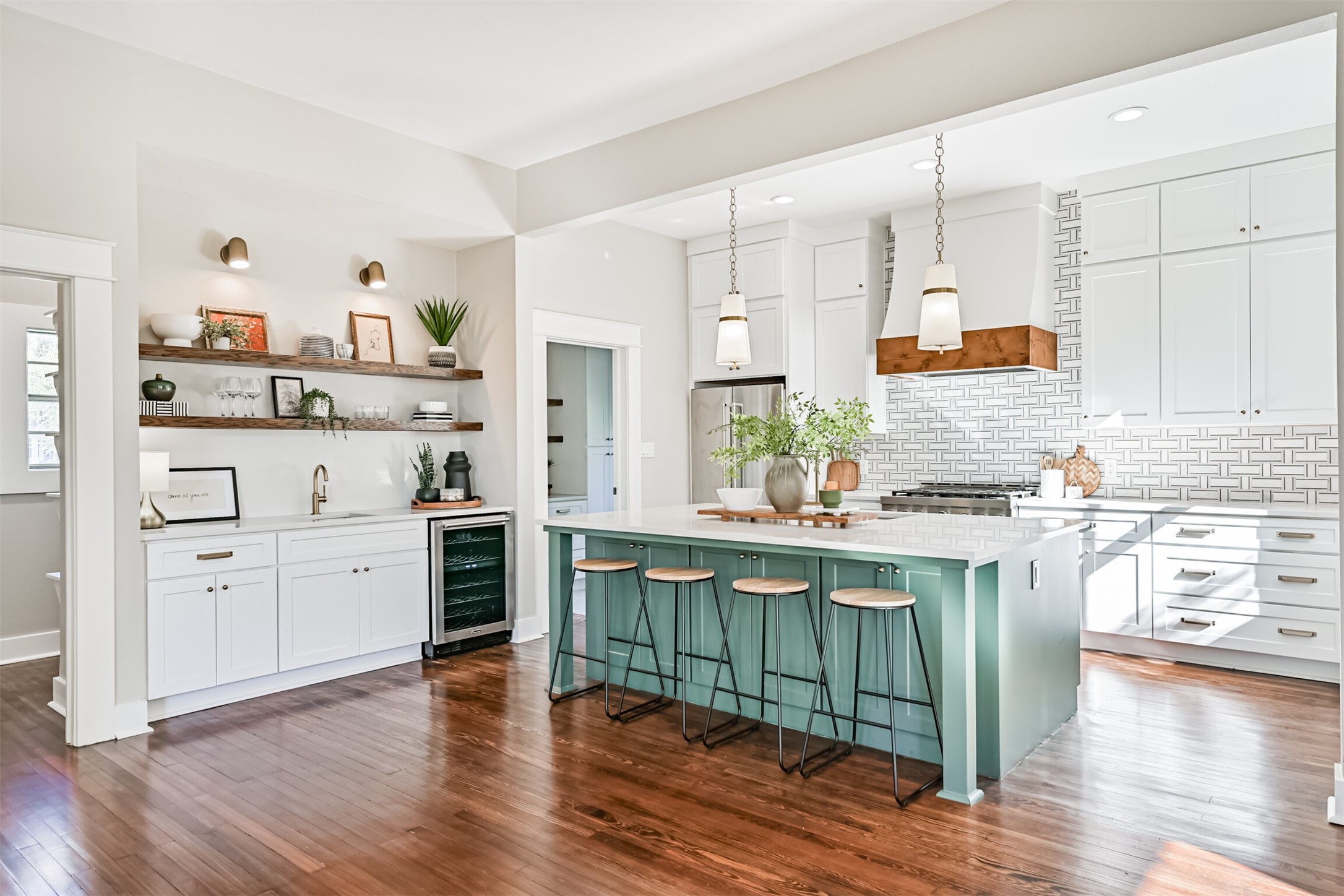 1310 Rosenberg Street Galveston, TX 77550 - Photo 8 of 50 a kitchen with white cabinets and appliances