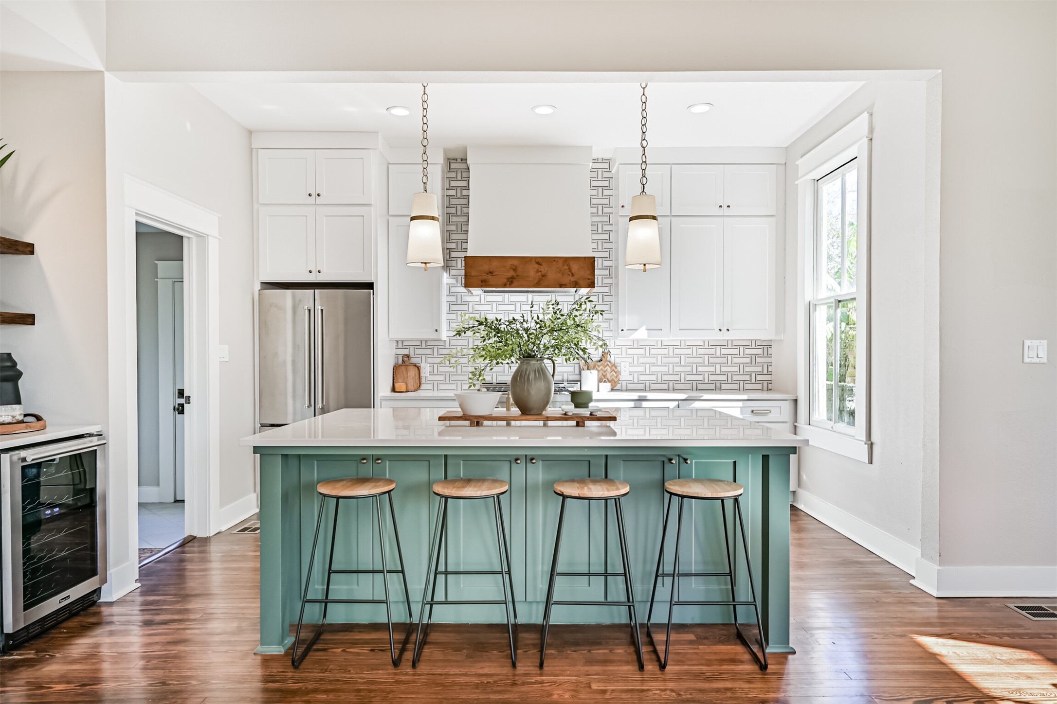 1310 Rosenberg Street Galveston, TX 77550 - Photo 9 of 50 a kitchen with kitchen island granite countertop a sink and chairs
