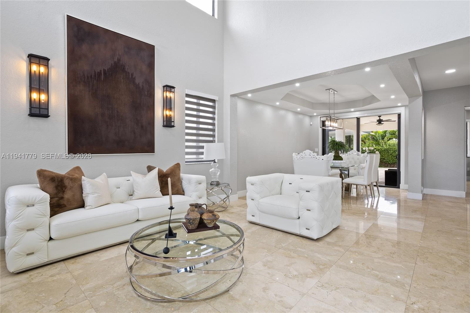 5324 Southwest 164th Court Miami, FL 33185 - Photo 18 of 47 a living room with furniture and a large window