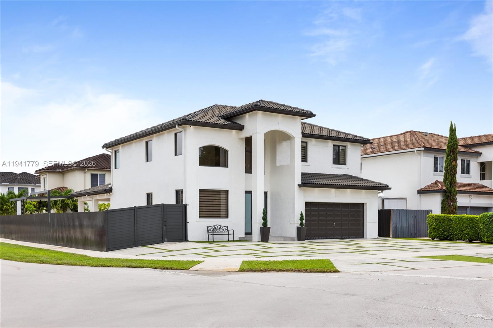 5324 Southwest 164th Court Miami, FL 33185 - Photo 2 of 47 a front view of a house with swimming pool and yard