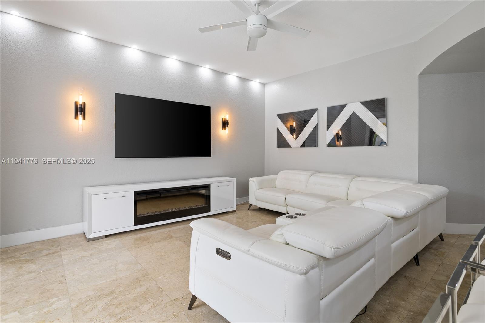 5324 Southwest 164th Court Miami, FL 33185 - Photo 29 of 47 a living room with furniture and a flat screen tv