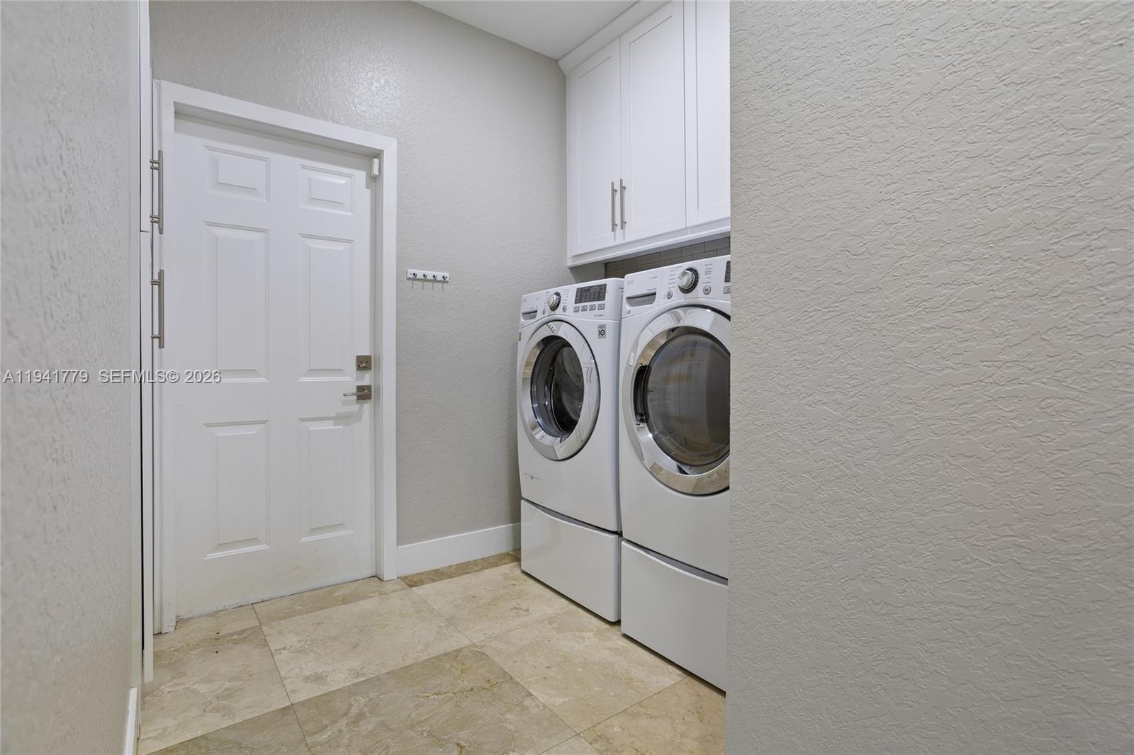 5324 Southwest 164th Court Miami, FL 33185 - Photo 30 of 47 a utility room with dryer and washer