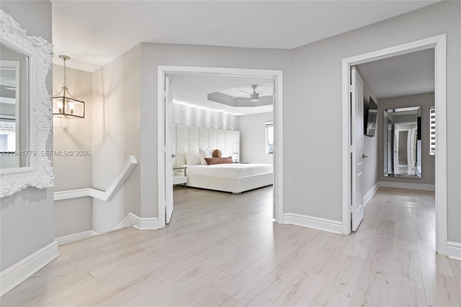 5324 Southwest 164th Court Miami, FL 33185 - Photo 33 of 47 a view of a bedroom with wooden floor and a bathroom