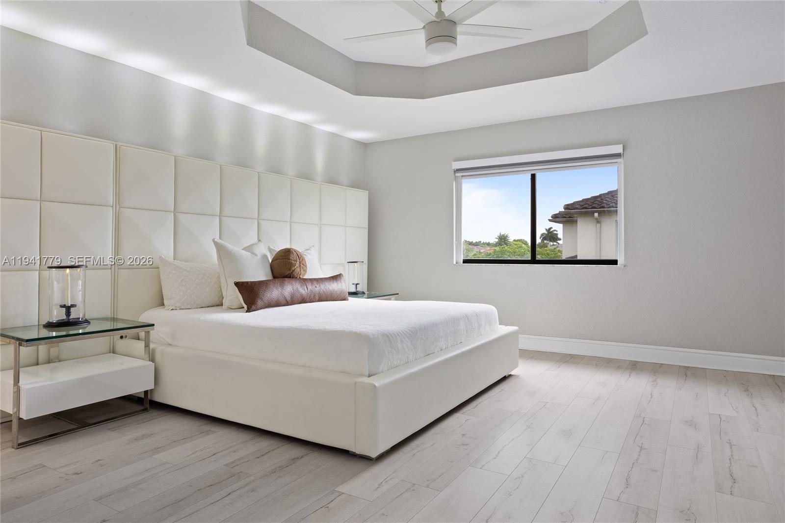 5324 Southwest 164th Court Miami, FL 33185 - Photo 34 of 47 a bedroom with a bed and a painting on the wall