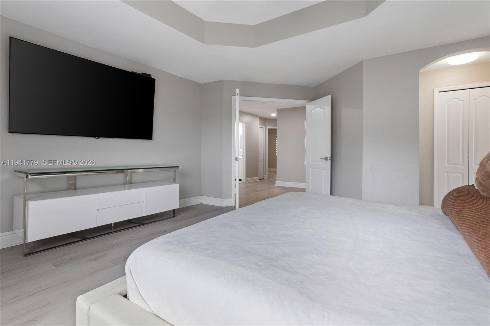 5324 Southwest 164th Court Miami, FL 33185 - Photo 35 of 47 a bedroom with a bed and a flat screen tv