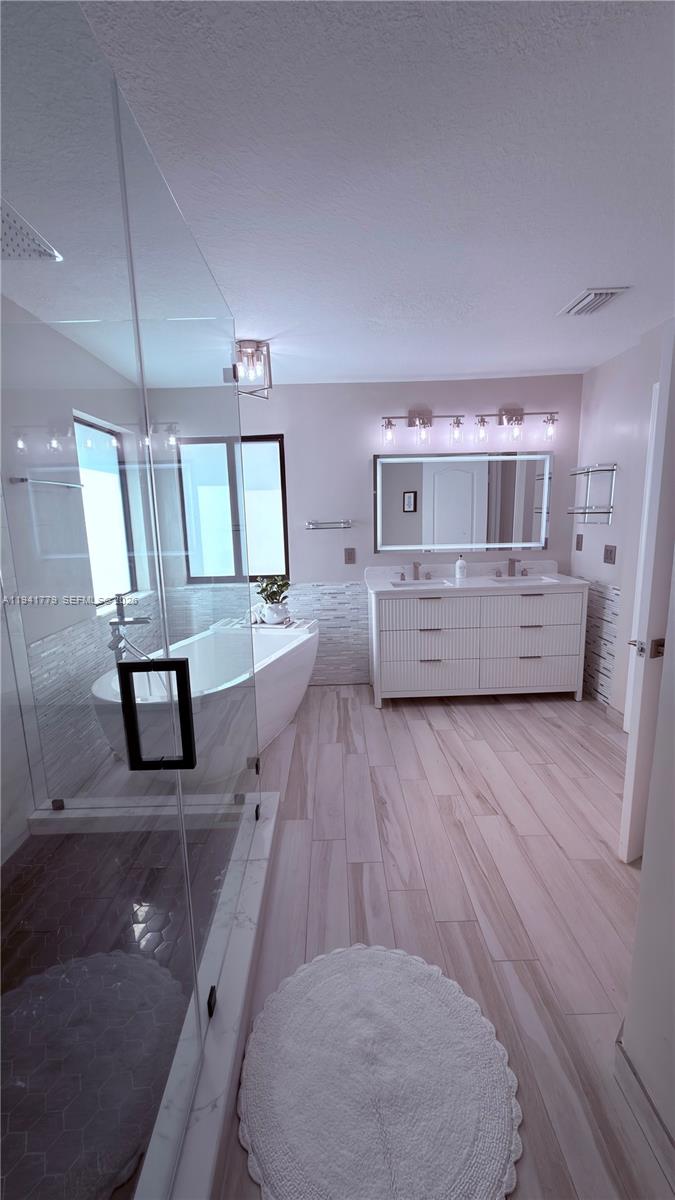 5324 Southwest 164th Court Miami, FL 33185 - Photo 38 of 47 a view of kitchen with cabinets and wooden floor