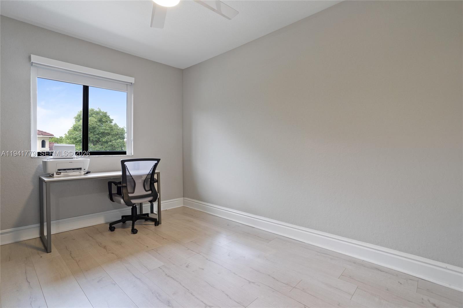 5324 Southwest 164th Court Miami, FL 33185 - Photo 43 of 47 a view of a workspace with furniture and a window