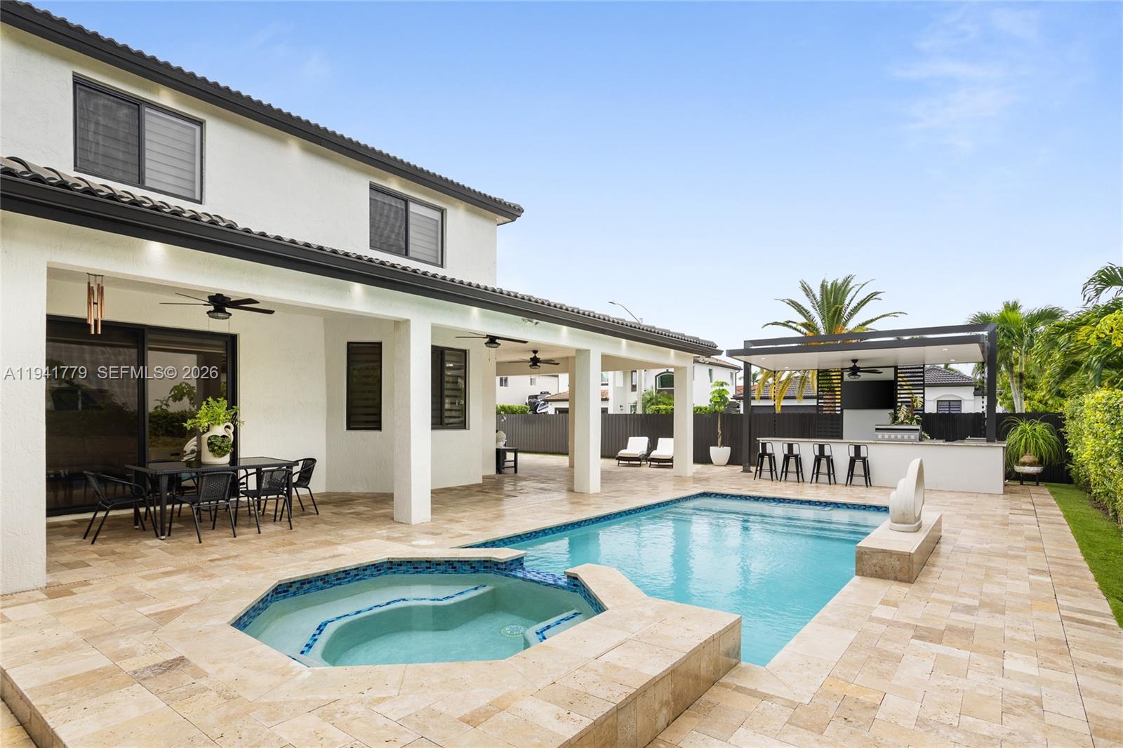 5324 Southwest 164th Court Miami, FL 33185 - Photo 7 of 47 a view of a house with swimming pool and sitting area