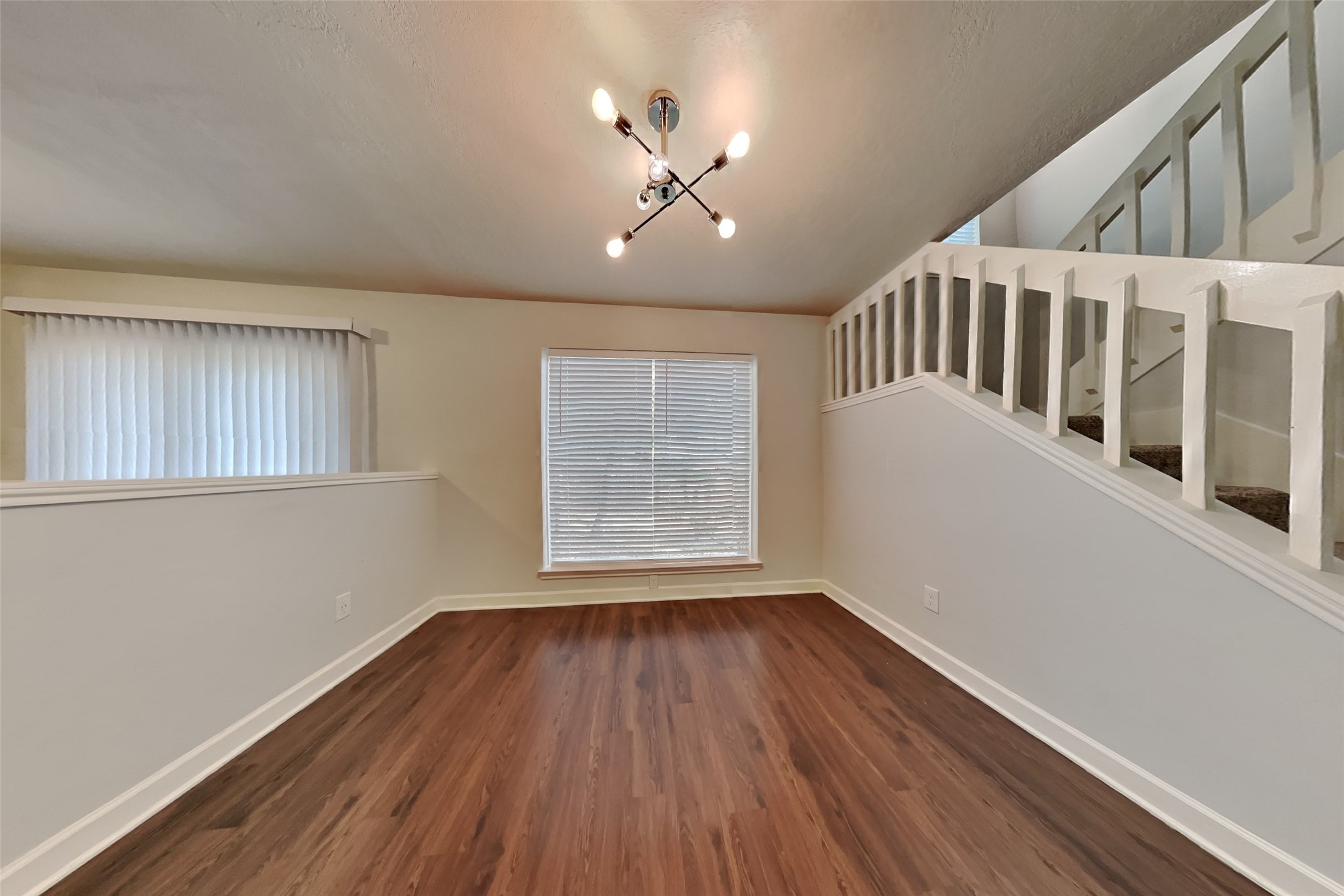 40 Rockfern Road Spring, TX 77380 - Photo 8 of 19 a view of an empty room with wooden floor and a window