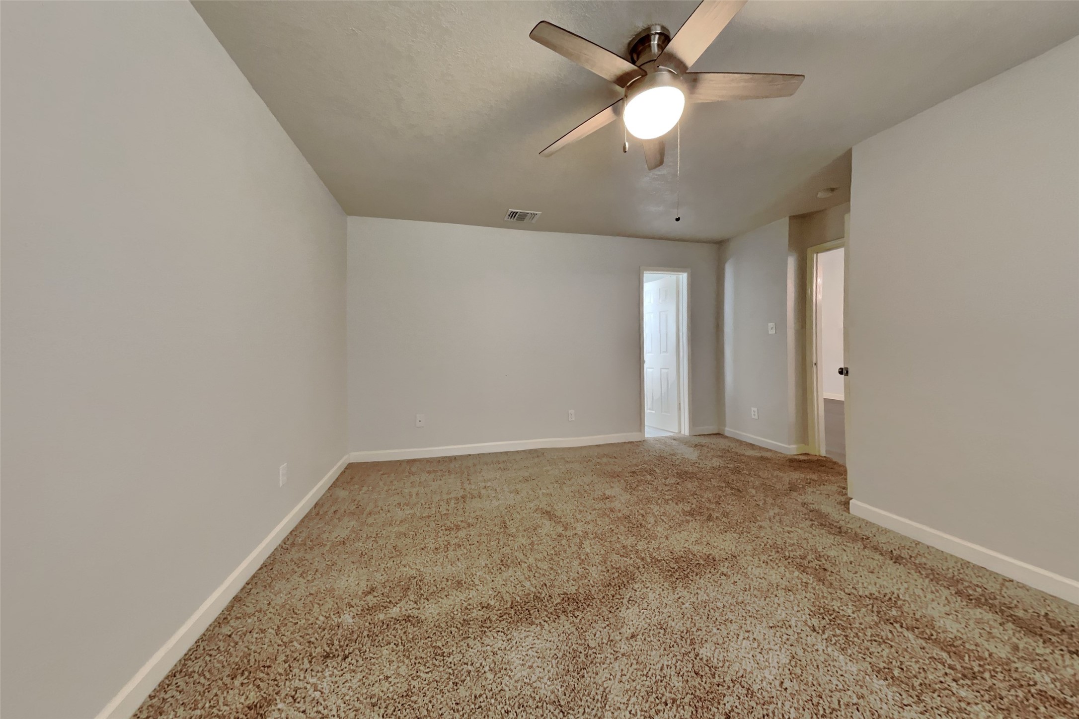 40 Rockfern Road Spring, TX 77380 - Photo 9 of 19 en empty room with ceiling fan and window