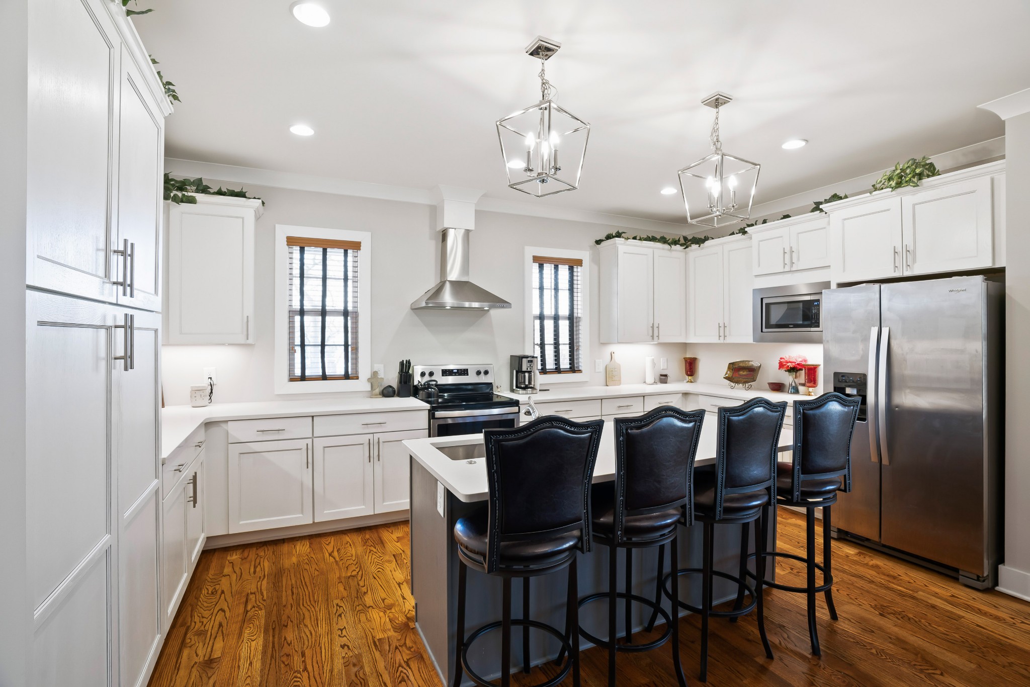 2350 Cooks Road Mount Juliet, TN 37122 - Photo 42 of 57 a kitchen with stainless steel appliances a dining table chairs stove and refrigerator