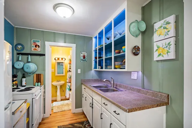 a kitchen with a sink and a refrigerator