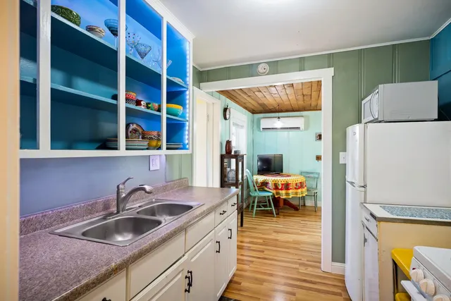 a bathroom with a sink mirror toilet and bathtub