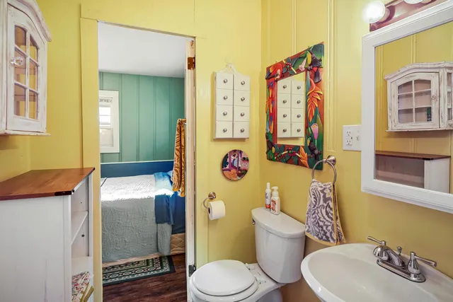 a bedroom with a bed and a dresser