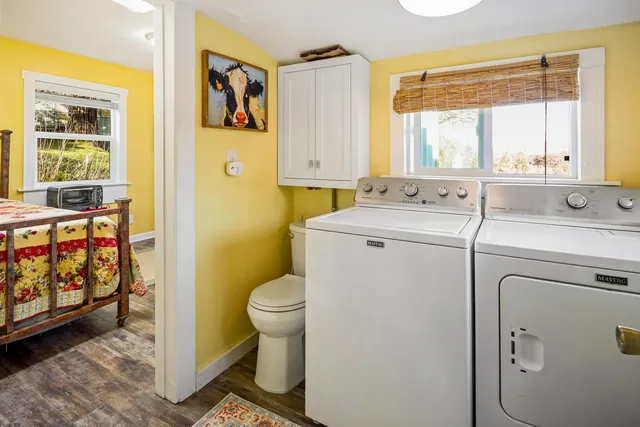 a bedroom that has a bed and a table in it