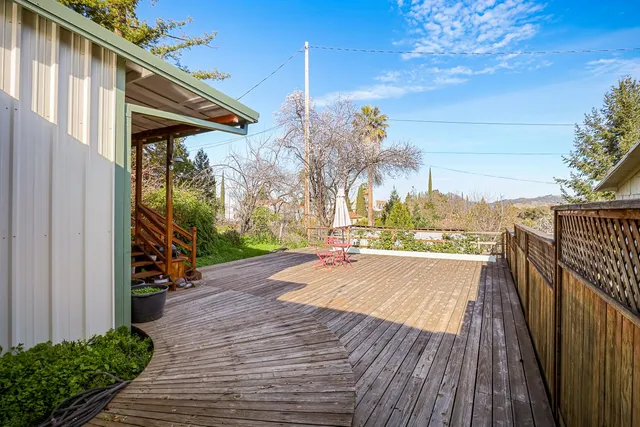 a view of a balcony with wooden floor