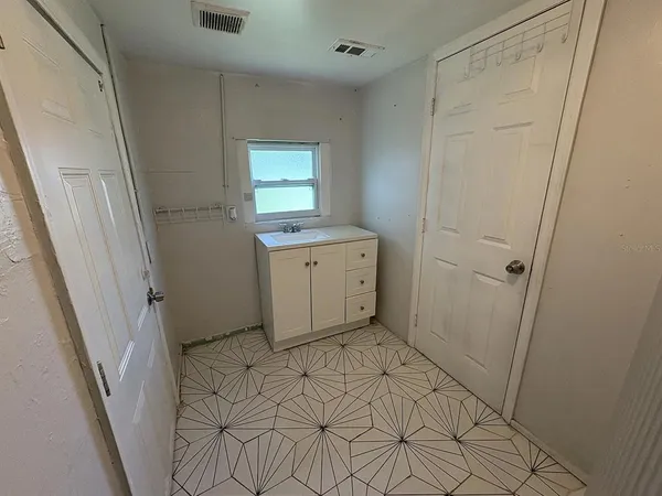 a view of a utility room with a sink