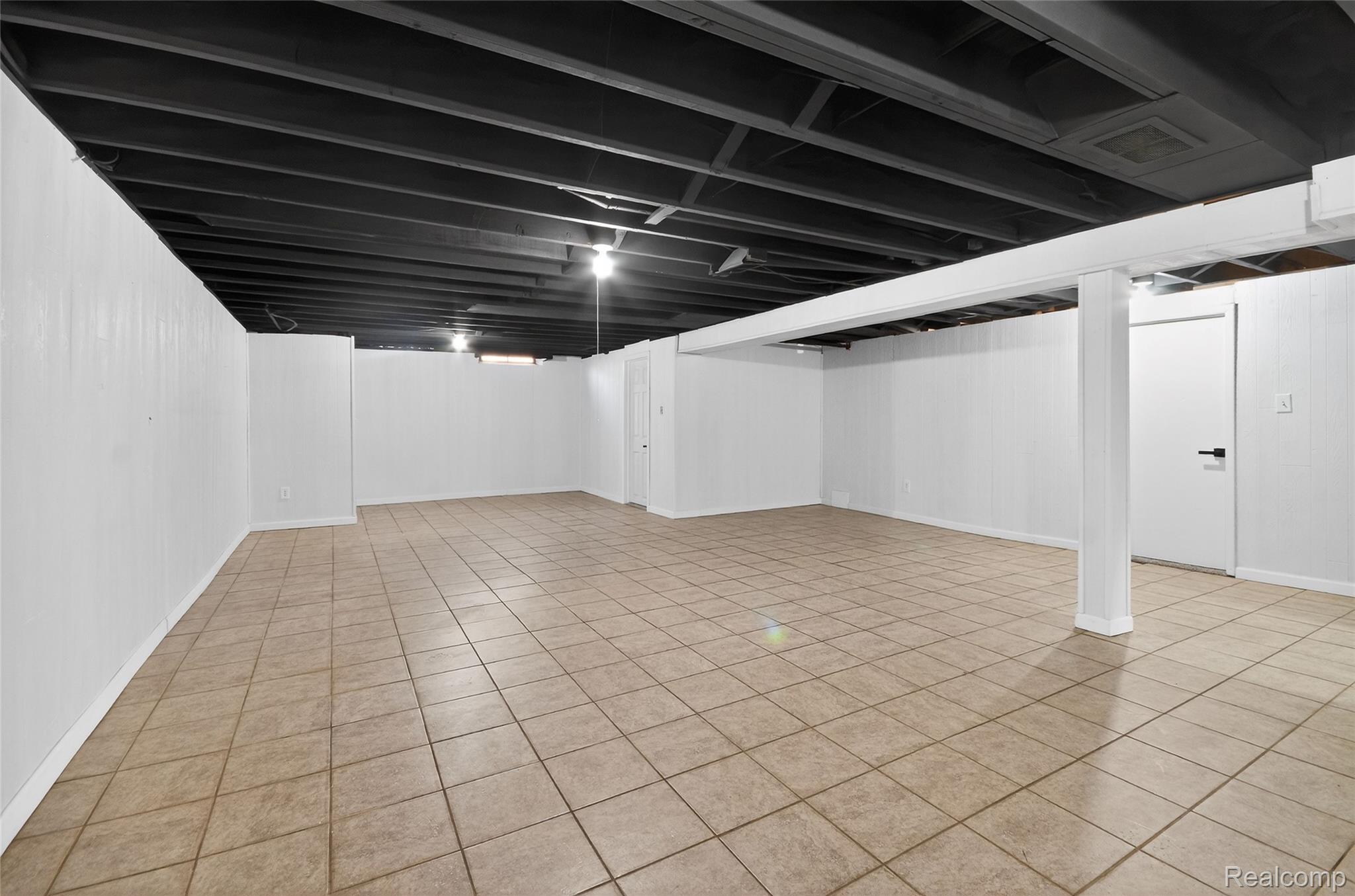 24065 Rockingham Street Southfield, MI 48033 - Photo 27 of 35 Finished basement with light tile patterned flooring and baseboards